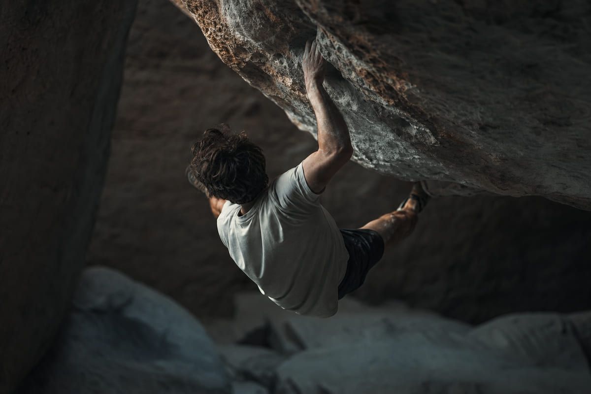 Advanced climber on a limit boulder.